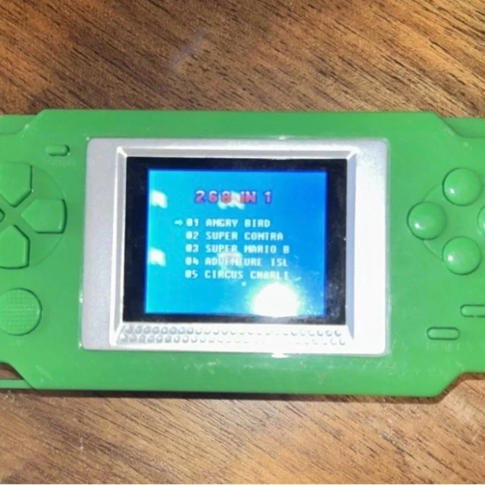 Green Handheld Gaming Console 268 games in 1. Missing the back cover